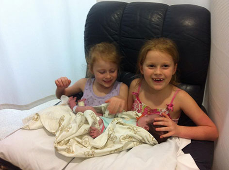 Baby Holly with her sisters