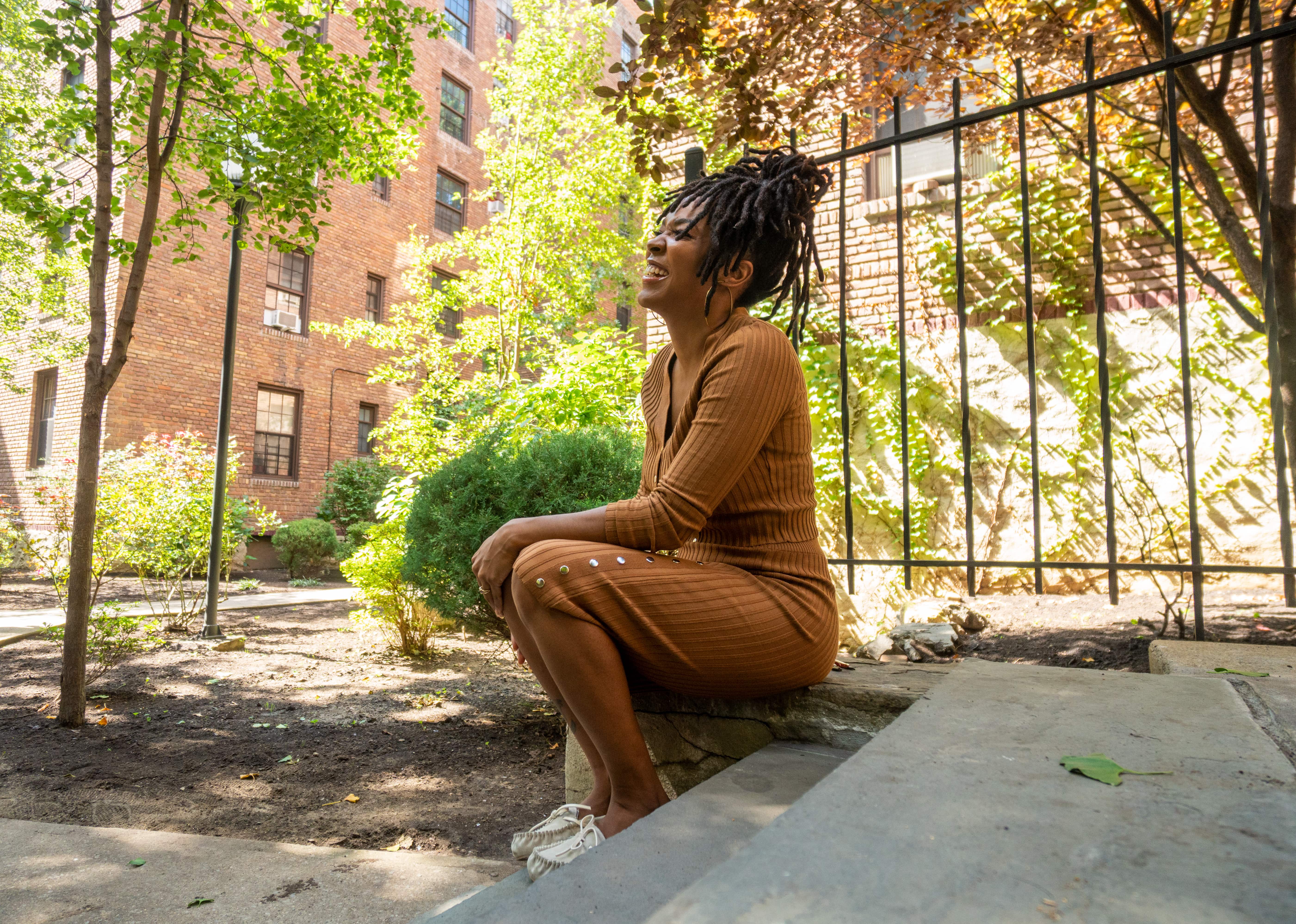 An image of LaToya Lennard in the garden at her apartment complex Dunbar Apartments in Harlem