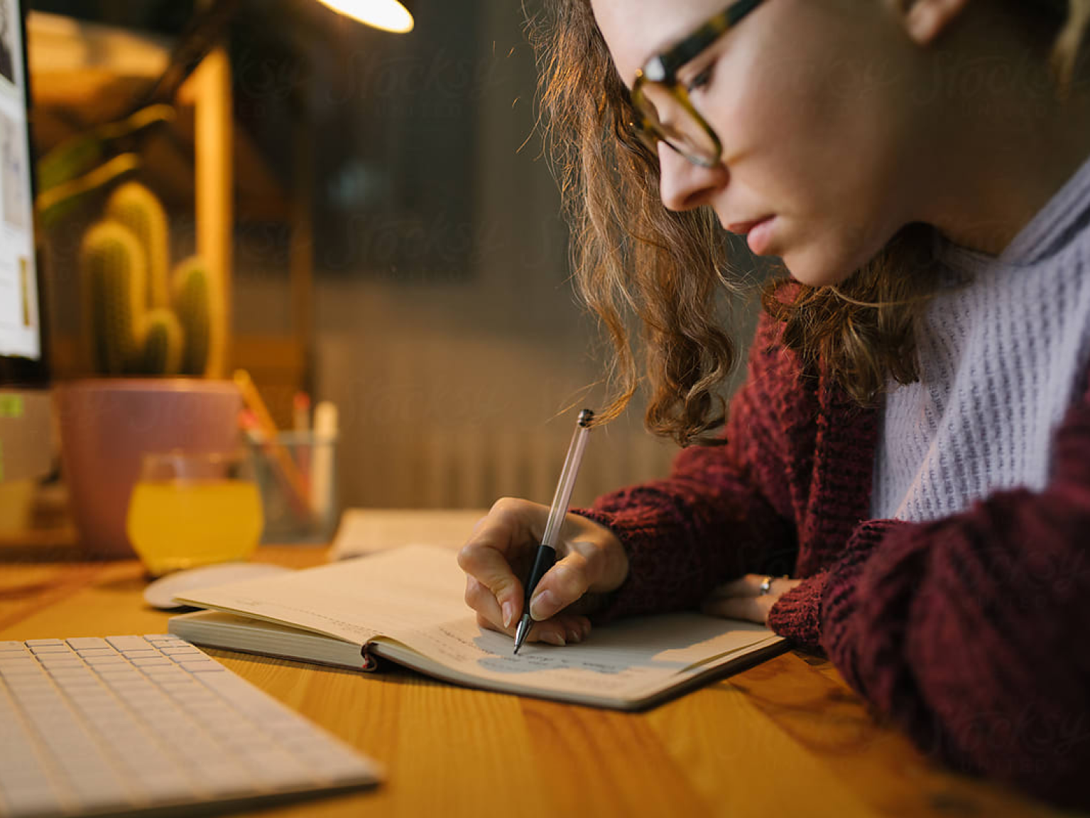 Image of a renter estimating how much utilities cost with a piece of paper and a pencil 