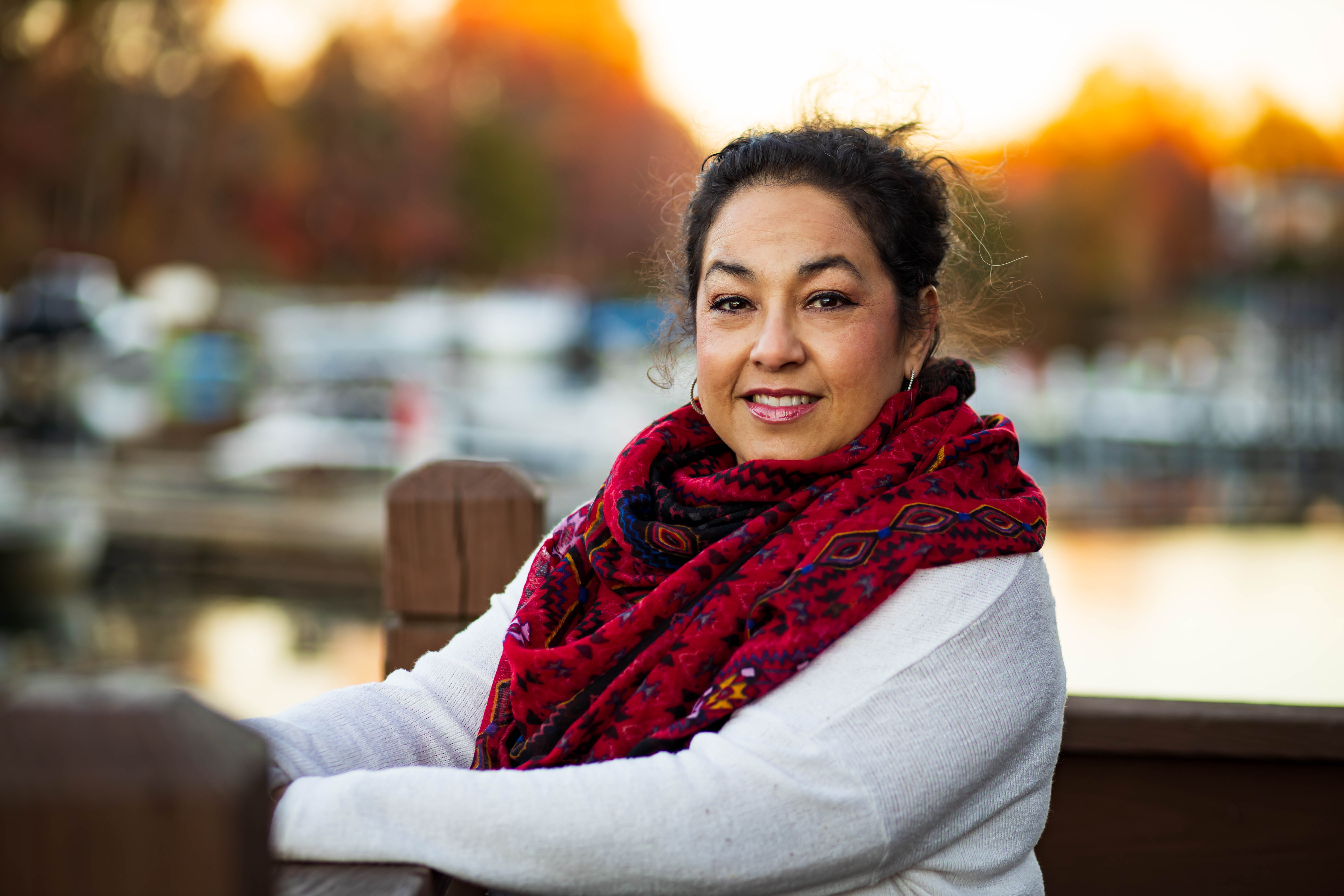 A photo of Ivette Arroyo by the marina at Sailpointe Apartments 