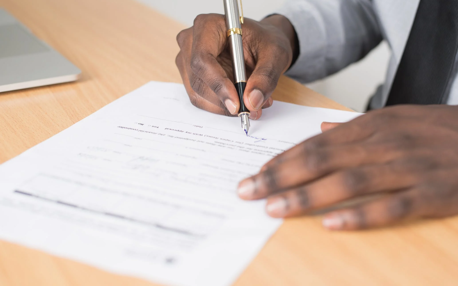 Image of a renter filling out an apartment application form