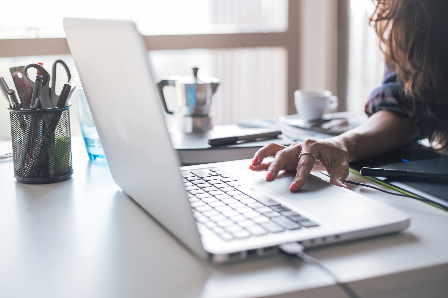 Woman working on a computer. 