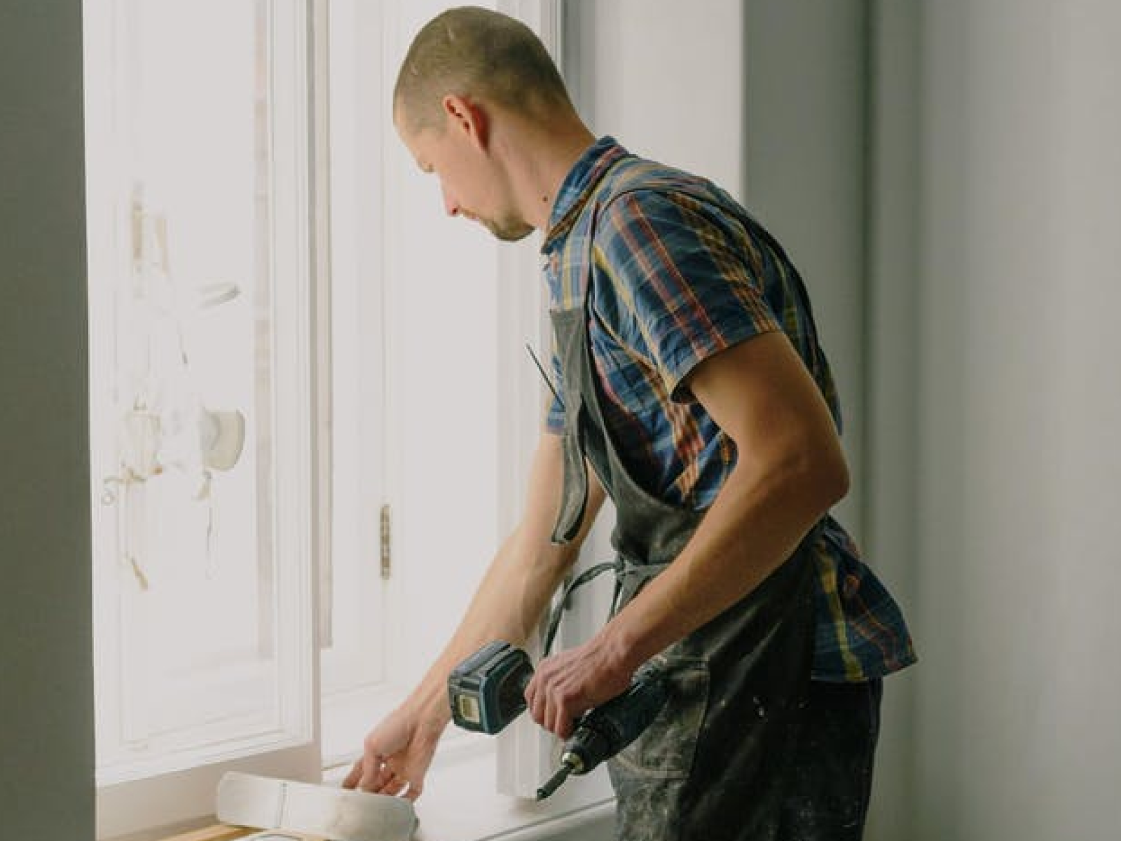 Image of a property owner renovating their home before renting.