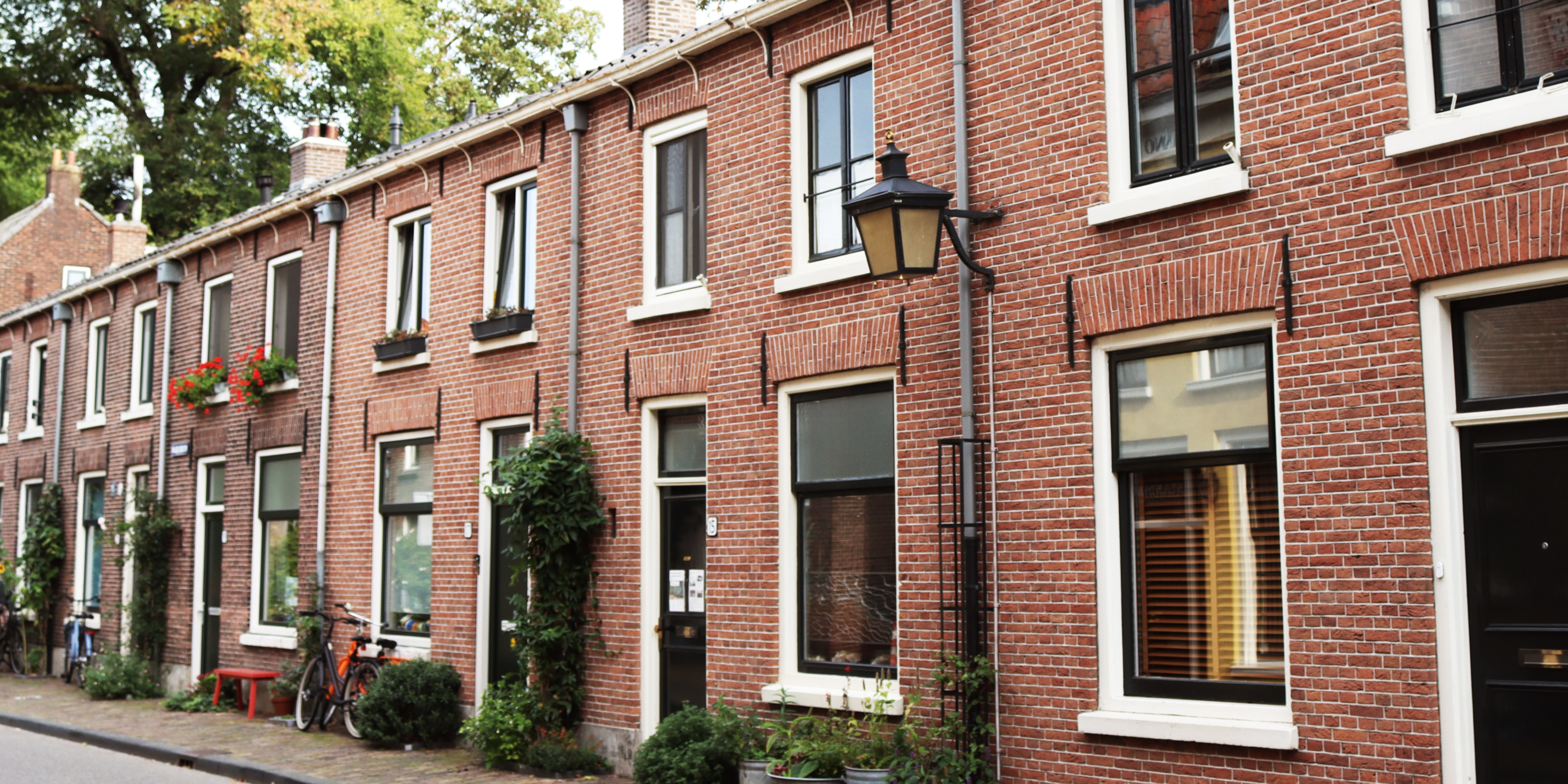 Image of classic brick apartment buildings on a quiet New York City street 