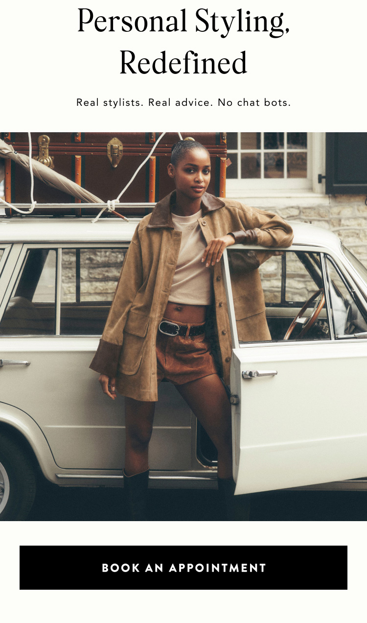 Personal Styling, Redefined. Real stylists. Real advice. No chat bots. Woman in tan jacket leaning on white vintage car.