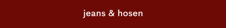White text reading "jeans & trousers" centered on a dark red background