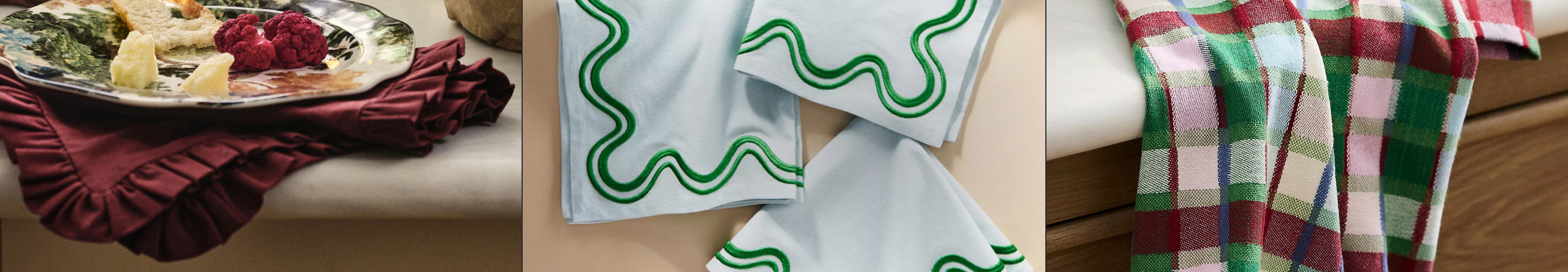 Three holiday napkin styles: burgundy ruffled napkin with cheese plate, white napkins with green wavy trim, and red-green plaid napkins.