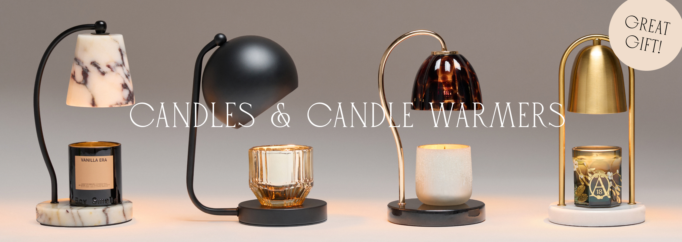 Five decorative candle warmers with various candles displayed beneath warming lamps. Text reads CANDLES & CANDLE WARMERS.