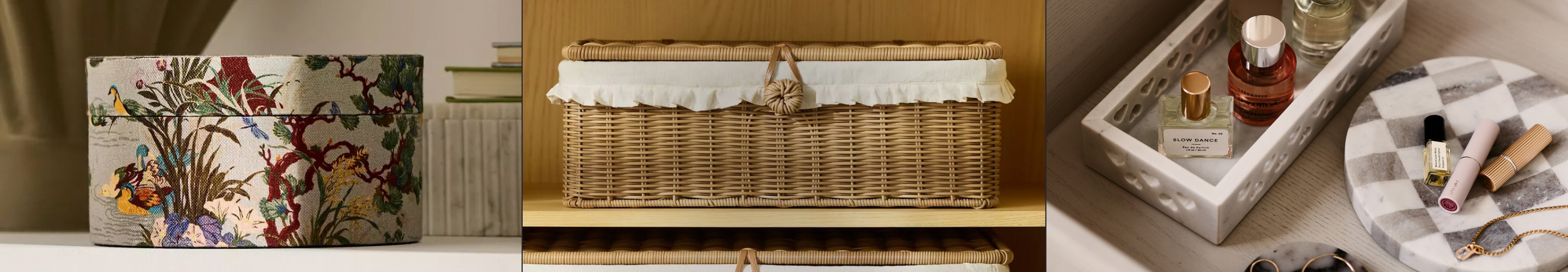 Three storage solutions: decorative box with floral bird pattern, wicker basket with white ruffle trim, and marble tray with perfumes.