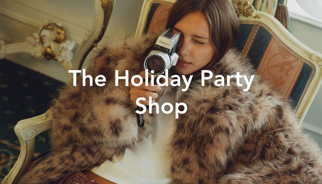 Woman in fur coat holding Canon video camera on ornate chair with text overlay reading "The Holiday Party Shop"