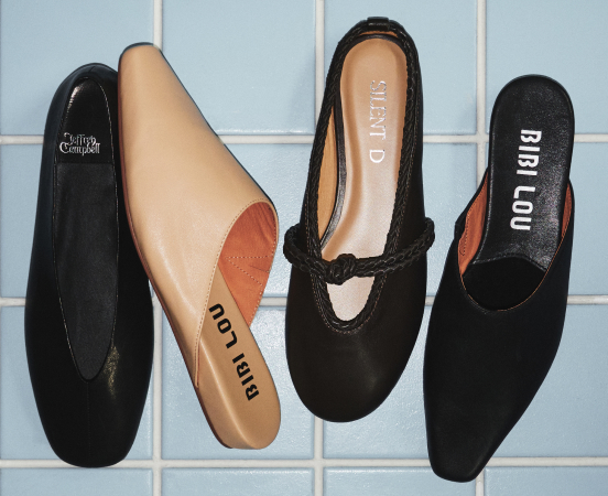 Four ballet flats in black and beige displayed on blue tile, showing brand names including BIBI LOU and ARTISTO on insoles.