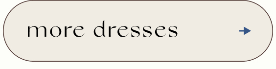 Button with text 'more dresses' in black serif font on beige background with right-pointing arrow