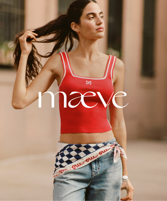Woman in red crop top with white stripes touching her ponytail, wearing checkered wrap over jeans, with maeve logo overlay