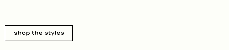 Black text reading shop the styles in a black rectangular border on a light beige background