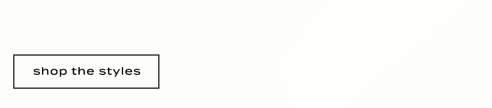 Black text reading shop the styles in a black rectangular border on a light beige background