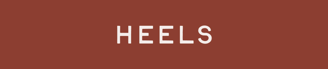 White text reading HEELS centered on a rust-colored background
