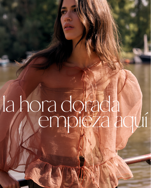 Woman in peach sheer blouse outdoors with text golden hour starts here in white lettering over sunlit background.
