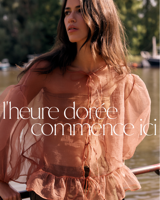 Woman in peach sheer blouse outdoors with text golden hour starts here in white lettering over sunlit background.