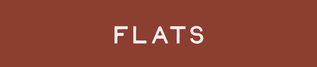 White text reading FLATS on a rust-colored background