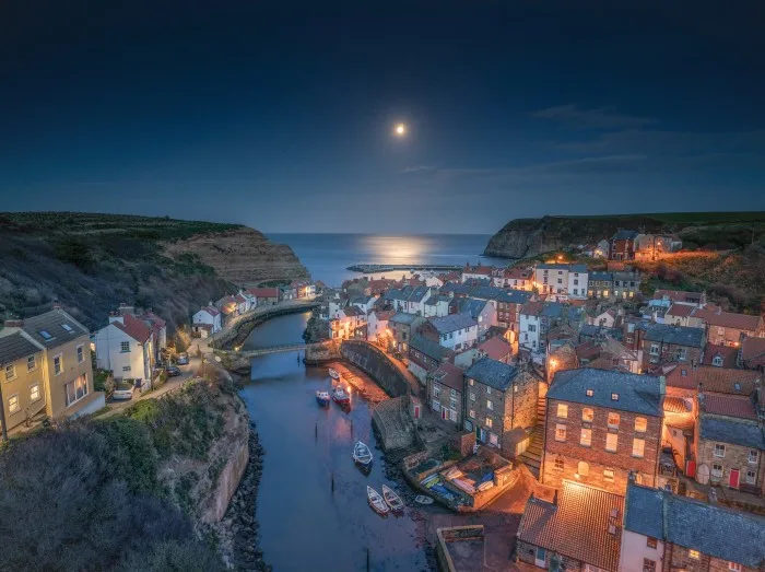 Moonrise over the North Yorkshire fishing village of Staithes.