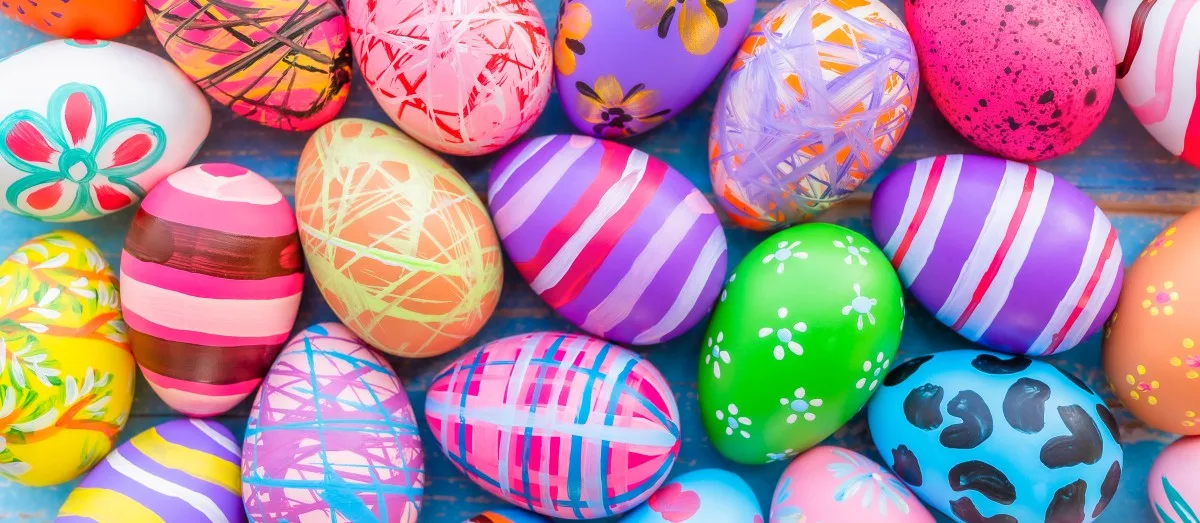 Beautiful colorful easter eggs on blue wooden