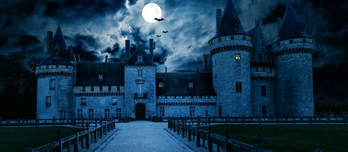 Haunted Gothic castle at night. Old spooky house in full moon. Creepy view of dark mystery castle with bats.