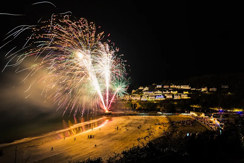 Looe New Year's Eve fireworks display at the beach in Cornwall, UK