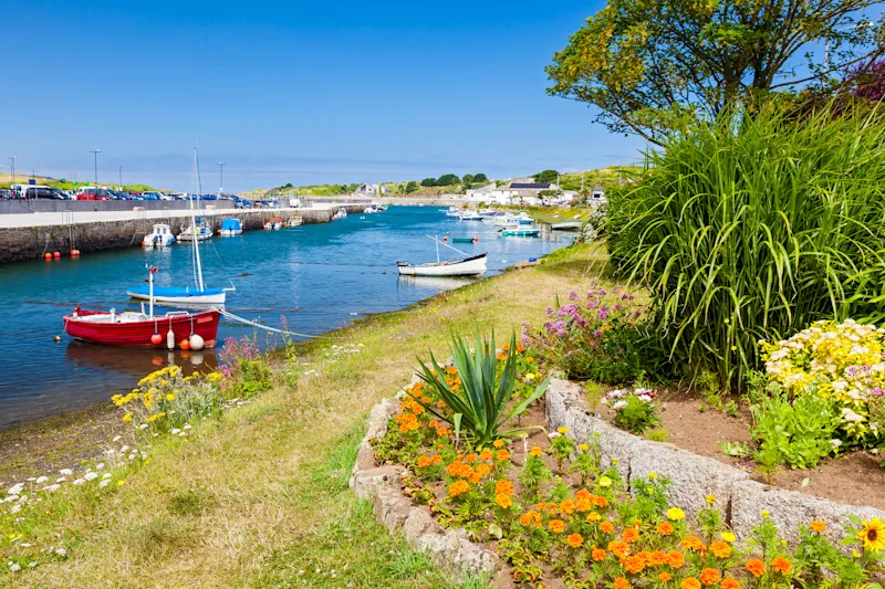 Fishing boats in Hayle Harbour on a sunny day in Cornwall, England, UK