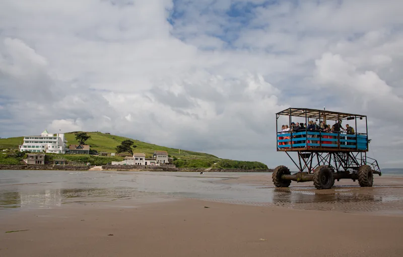 Sea tractor taking visitors along the beach to Burgh Island, South Devon, UK