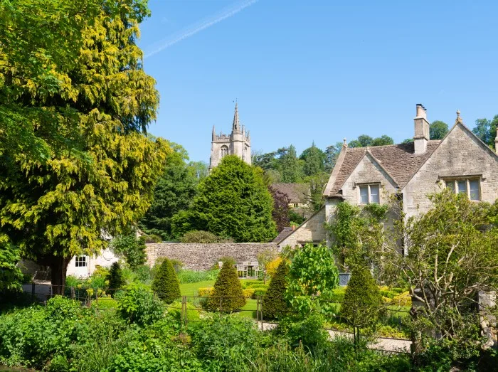 View of village and church Castle Combe Wiltshire