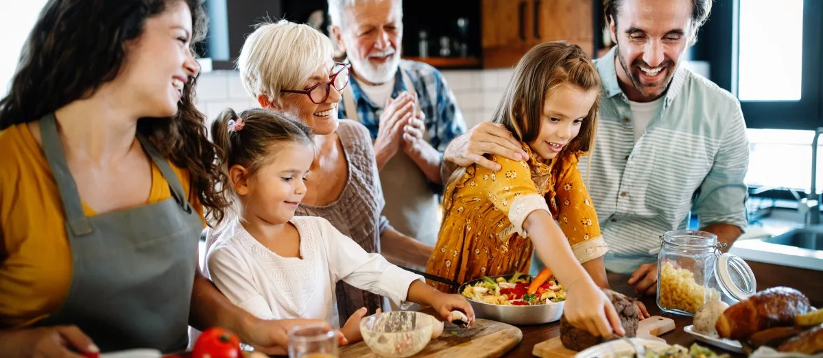 Portrait of happy family in kitchen at home