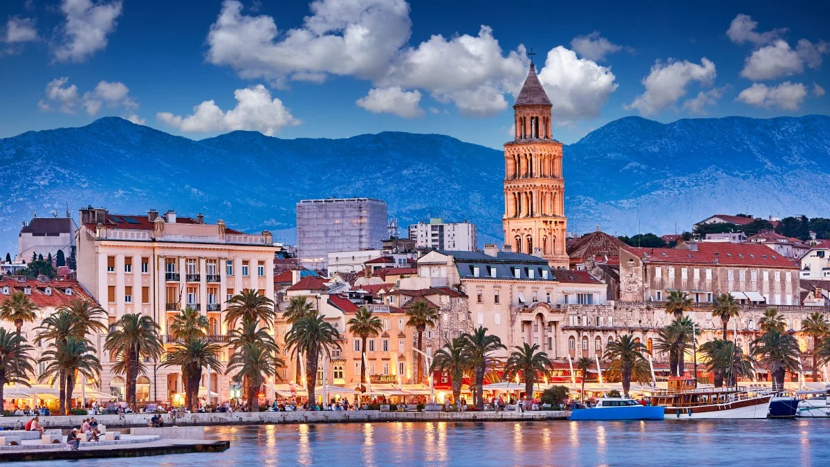 Split, Croatia. View of Split - the second largest city of Croatia at night. Shore of the Adriatic Sea and famous Palace of the Emperor Diocletian.