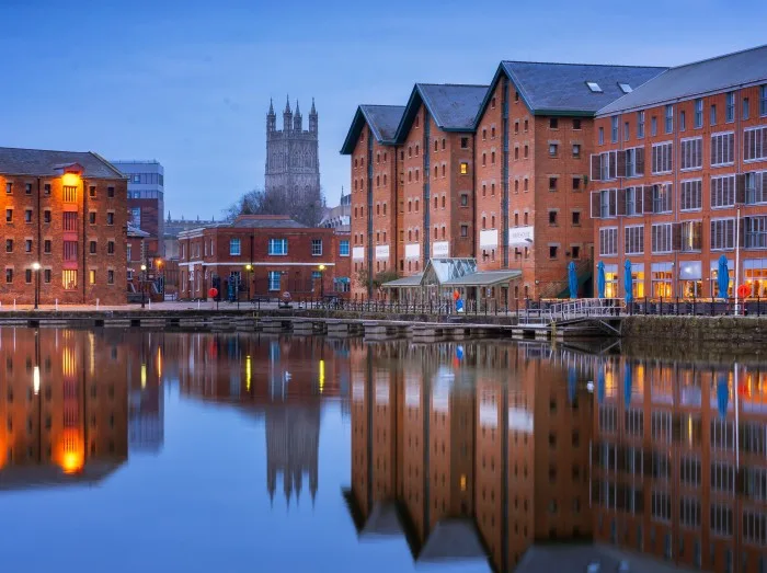 Gloucester docks and Cathedral reflected in the quay on Sharpness at twilight