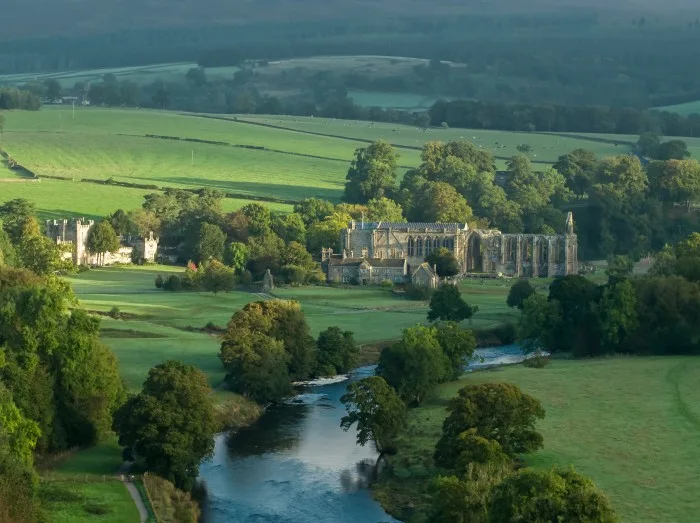 Early morning sunshine illuminates Bolton Abbey in Wharfedale, North Yorkshire