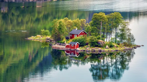 Red cabins on a small island in Norway.