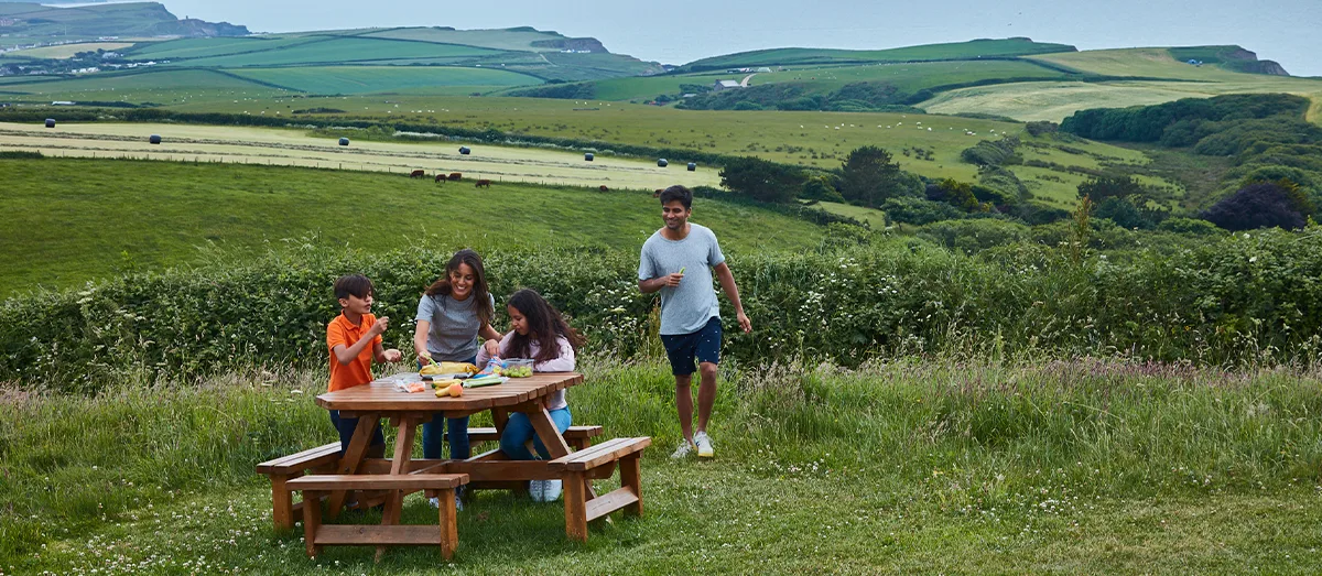 Family enjoying a picnic in the countryside
