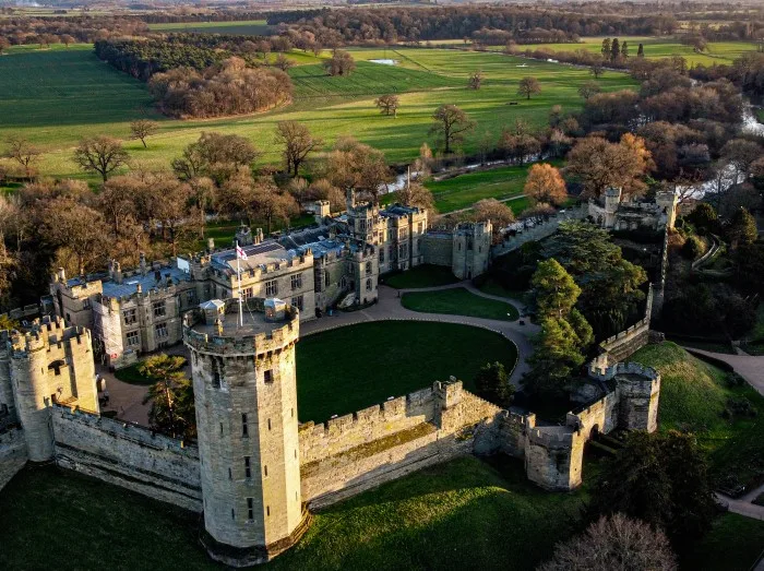 Drone view of the Warwick castle in the daytime.