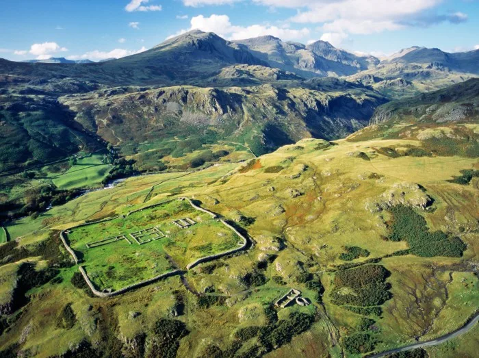 Hardknott Roman Fort with Scafell mountain behind above Eskdale in Lake District National Park Cumbria