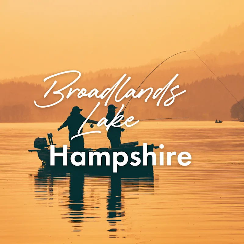 Silhouette of man fishing on lake from boat at sunset.