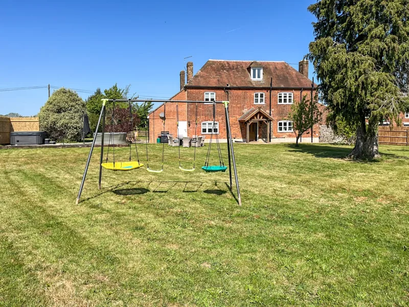 Swing set in the enclosed garden at a family friendly cottage - Harvel House Farm, Meopham, Gravesend, Kent, UK