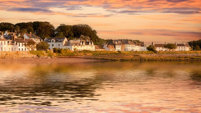 The Scottish village of Garlieston, Dumfries and Galloway, Scotland, UK, with an added colourful sky and reflection.
