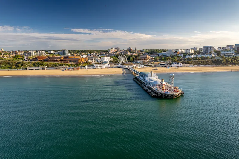 The drone aerial view of Bournemouth beach, Observation Wheel and Pier. Bournemouth is a coastal resort town in Dorset on the South Coast of England, UK