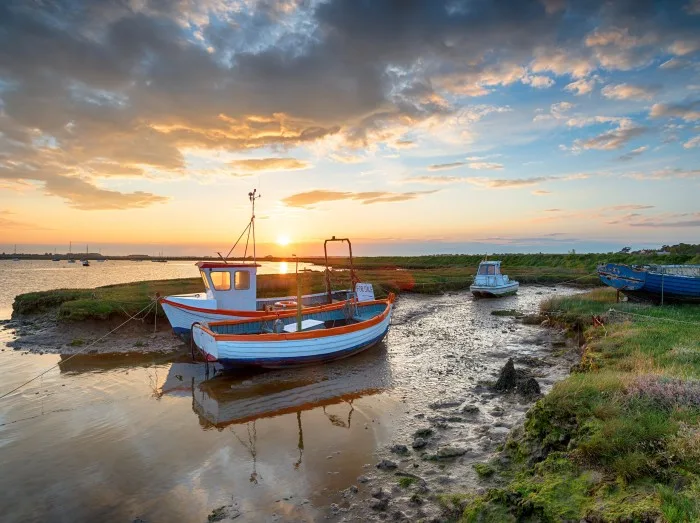 Stunning sunset over old fishing boats