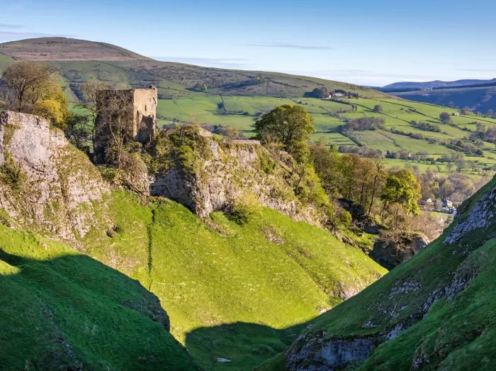 The ruins of Peveril Castle above Cave Dale near Castleton in the Peak District National Park, Derbyshire