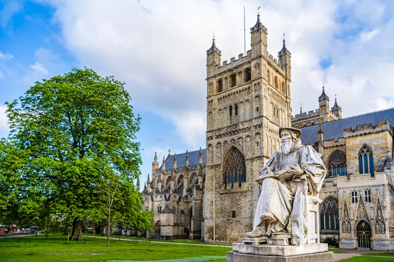 Statue of Richard Hooker in front of Exeter Cathedral, Exeter, South Devon, UK