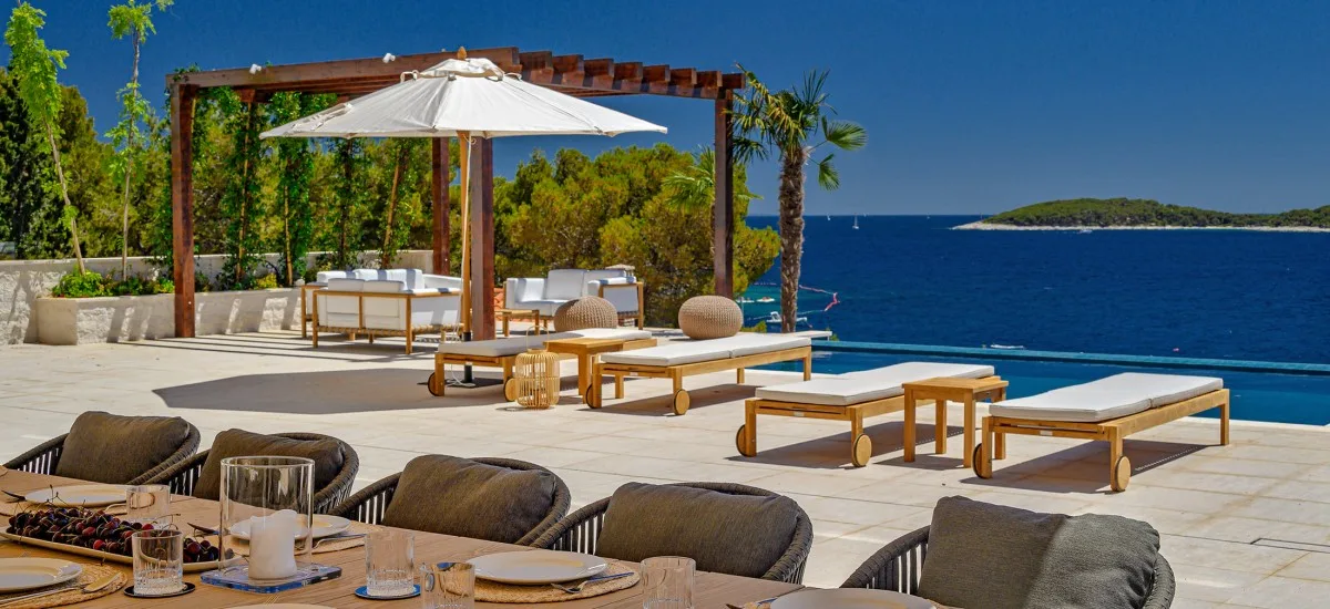 View from a holiday home over a terrace and the sea in Croatia.