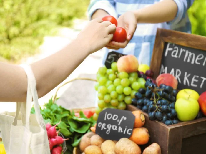 Woman buying products at farmer's market