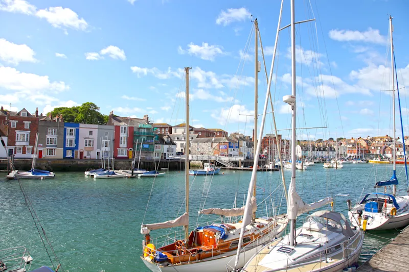 Sailing boats in the harbour the historic seaside town of Weymouth in Dorset, England, UK