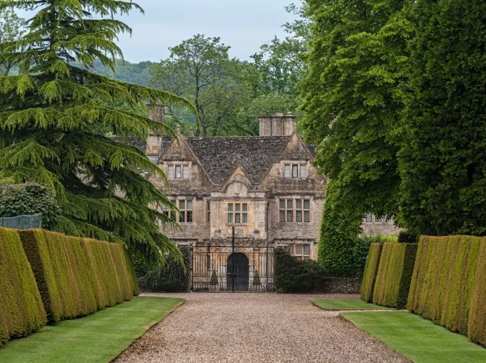 Upper Slaughter Manor House is a picturesque Elizabethan manor set on 8 acres of landscaped gardens in Cotswolds village 