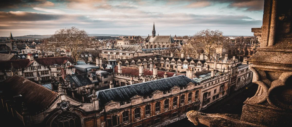 View of the University Church of St Mary the Virgin, opposite the Radcliffe Camera in Oxford, England